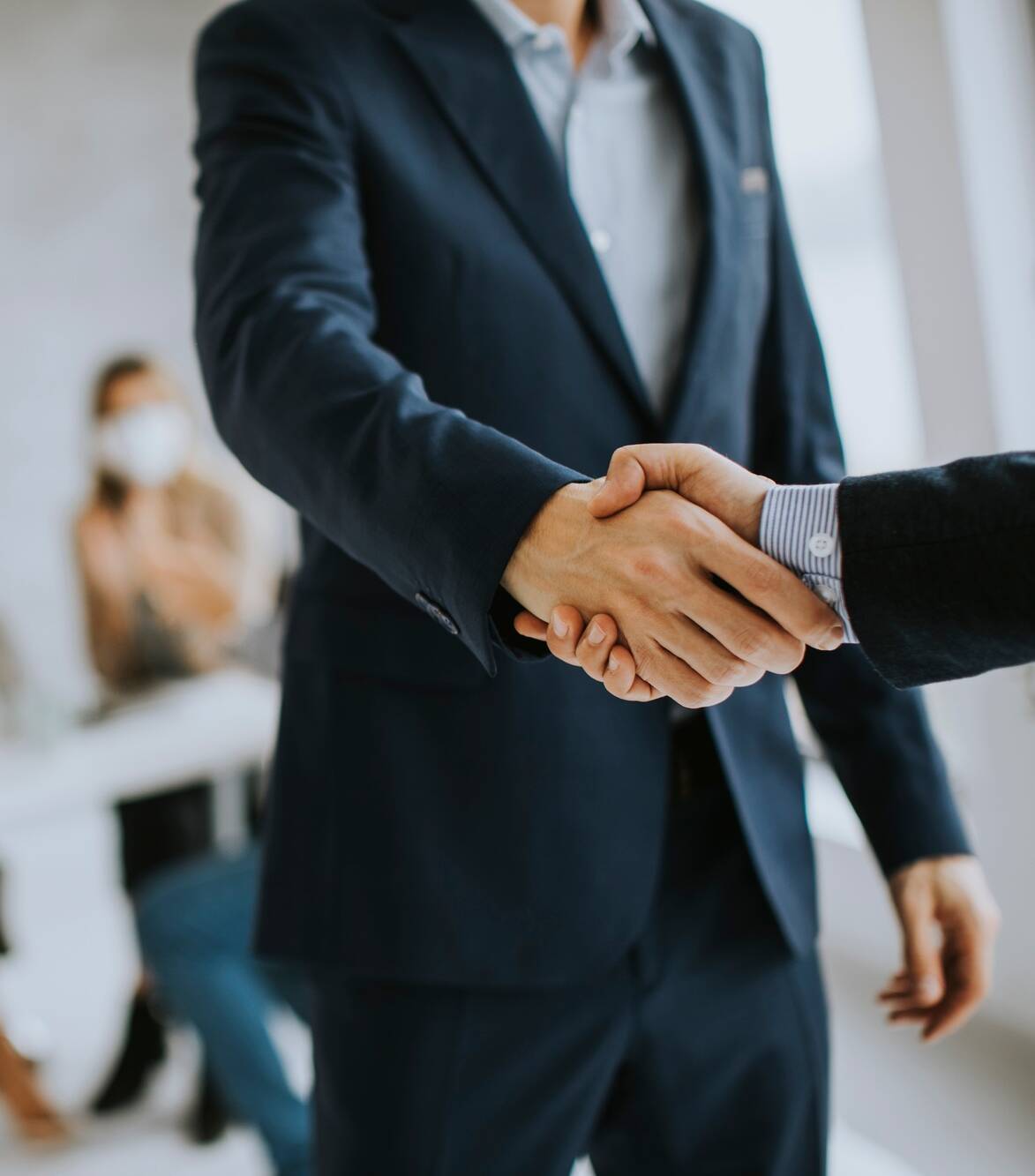 Young business men handshaking in the office